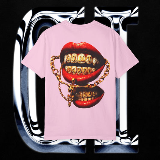 Guilt Haven 1999 Tee – Unisex Garment-Dyed T-Shirt | Gold Grill Lips & Chain Skeleton Graphic on pink shirt.