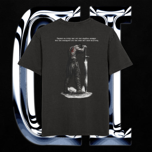 Black t-shirt with graphic design and text on a reflective silver and black background